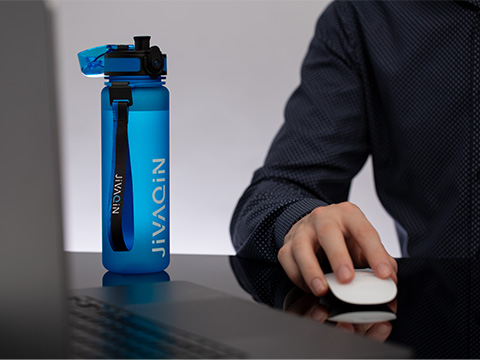 Drinking bottle myCasan on the desk Drinking bottle myCasan refined with logo and carrying loop