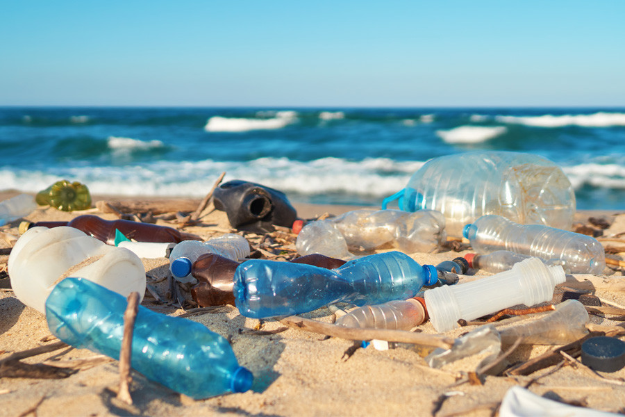 Plastic waste on the beach Plastic bottles and rubbish on the beach