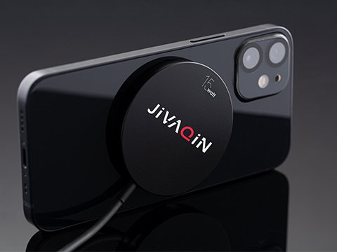 Magnetic wireless charger as promotional item Magnetic wireless charger on the back of the smartphone with promotional print