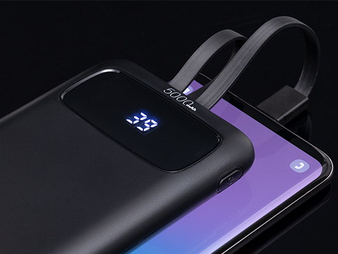 5000 mAh powerbank as promotional item Powerbank with cable connected to mobile phone
