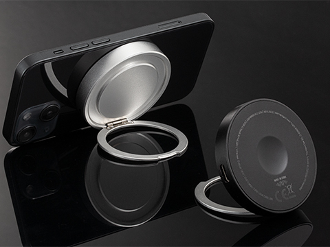Magnetic wireless charger with mobile phone stand Magnetic wireless charger with mobile phone stand on smartphone