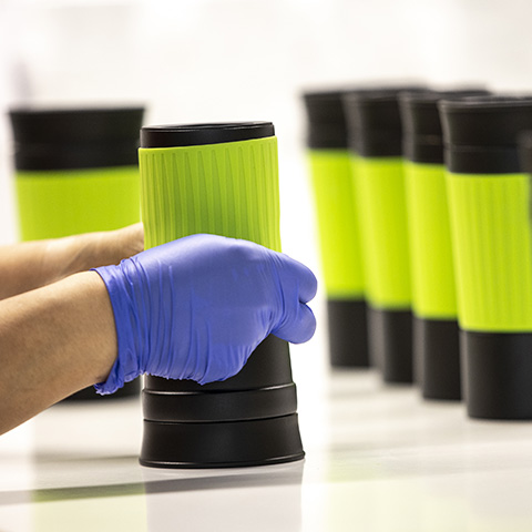 REFLECTS employees assemble the promotional items Packaging of REFLECTS promotional items