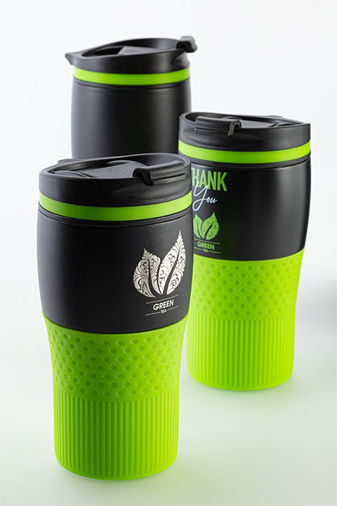 Green Tea engraving and print sample of myBayamo thermo mug myBayamo thermo mug in black with light green silicone ring and sleeve and sample logo