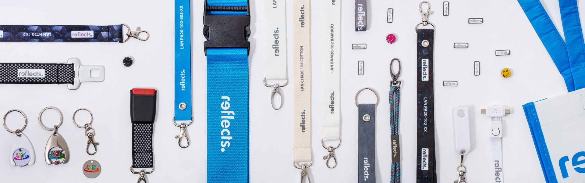 Lanyards, Pins, Einkaufswagenchips mit REFLECTS Logo lanyards, pins, Einkaufswagenchips von REFLECTS