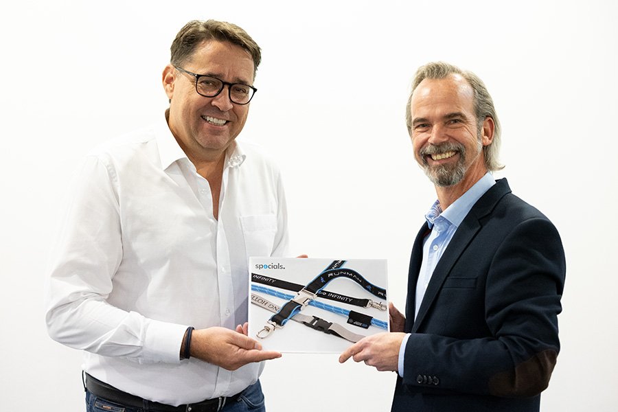 Managing Director Meinhard Mombauer and Dirk Haynberg show Aditan Lanyard Catalogue