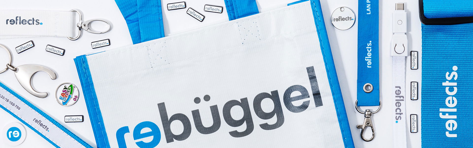 REFLECTS rebueggel Werbeartikel Pins, Lanyards, Einkaufswagenchips und Taschen von REFLECTS